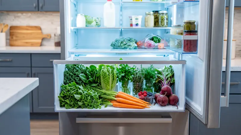 Fresh produce stored in a refrigerator crisper drawer